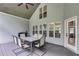 Covered patio with outdoor dining set, grill, and view of the landscaped backyard at 7269 Tyree Rd, Winston, GA 30187