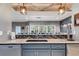 Wet bar area with modern fixtures and a view of the dining space at 7269 Tyree Rd, Winston, GA 30187