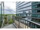 Balcony view overlooking green space, surrounding buildings, and city landscape at 923 Peachtree Ne St # 1238, Atlanta, GA 30309