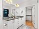 Granite countertop and double vanity offer space and style in this bright bathroom at 923 Peachtree Ne St # 1238, Atlanta, GA 30309