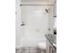 Clean bathroom featuring white tile and a shower-over-tub combination at 923 Peachtree Ne St # 1238, Atlanta, GA 30309