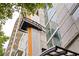 The Metropolis building exterior featuring modern architectural design with a sign and balconies at 923 Peachtree Ne St # 1238, Atlanta, GA 30309