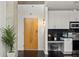Stylish entrance with a modern kitchen, white cabinets, and eat in area at 923 Peachtree Ne St # 1238, Atlanta, GA 30309