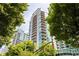 High-rise building surrounded by lush trees and greenery at 923 Peachtree Ne St # 1238, Atlanta, GA 30309
