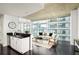 Open living space with city views, modern decor, and hardwood flooring at 923 Peachtree Ne St # 1238, Atlanta, GA 30309