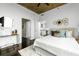 Bright main bedroom featuring hardwood floors, ceiling fan, and decorative wall art at 923 Peachtree Ne St # 1238, Atlanta, GA 30309