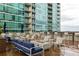 Luxurious outdoor lounge area with fire pit and comfortable seating perfect for gathering and relaxation at 923 Peachtree Ne St # 1238, Atlanta, GA 30309