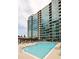 Relax and unwind by the building's outdoor swimming pool with lounge chairs and city views at 923 Peachtree Ne St # 1238, Atlanta, GA 30309