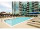 Outdoor pool with lounge chairs offering a relaxing space and sunny views at 923 Peachtree Ne St # 1238, Atlanta, GA 30309