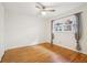 Cozy bedroom featuring hardwood floors, a ceiling fan, and double hung windows at 1284 Piedmont Ne Ave # 12, Atlanta, GA 30309