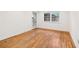 Bright bedroom with hardwood flooring, white walls and a door leading to the exterior at 1284 Piedmont Ne Ave # 12, Atlanta, GA 30309