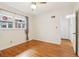Comfortable bedroom with hardwood flooring, a ceiling fan, and double windows at 1284 Piedmont Ne Ave # 12, Atlanta, GA 30309