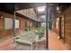 Charming courtyard featuring a bench, brick floors, plants and wooden walkways, offering a tranquil outdoor living space at 1284 Piedmont Ne Ave # 12, Atlanta, GA 30309