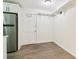 Kitchen area showcases stainless steel appliances, a door to the outside, open shelving, and hardwood floors at 1284 Piedmont Ne Ave # 12, Atlanta, GA 30309