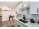 Updated kitchen with white cabinets, stainless steel appliances, and modern countertops at 1284 Piedmont Ne Ave # 12, Atlanta, GA 30309