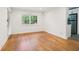Bright living room adjacent to the kitchen features hardwood floors, neutral walls, and natural light at 1284 Piedmont Ne Ave # 12, Atlanta, GA 30309