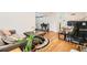 Open-concept living space with hardwood floors, a comfortable sofa, and seamless flow to other areas of the home at 1284 Piedmont Ne Ave # 12, Atlanta, GA 30309