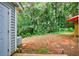 View of a spacious backyard featuring lush greenery and mature trees, providing privacy and a serene outdoor space at 1830 Broadway St, Decatur, GA 30035