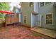 Backyard featuring a deck, red dirt, and rear entry at 1830 Broadway St, Decatur, GA 30035