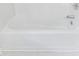 An up-close, detailed view of a clean, all-white bathtub and shower, perfect for relaxing and enjoying a spa-like experience at 1830 Broadway St, Decatur, GA 30035