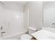Bathroom featuring a shower-tub combo, toilet, and vanity with a sink at 1830 Broadway St, Decatur, GA 30035