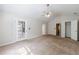 This is a spacious carpeted bedroom that provides a door to the patio as well as a closet for storage at 1830 Broadway St, Decatur, GA 30035