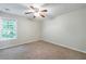 Bedroom featuring a ceiling fan, carpet, and window at 1830 Broadway St, Decatur, GA 30035