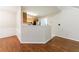 Open dining area next to the kitchen featuring hardwood floors and wainscoting at 1830 Broadway St, Decatur, GA 30035