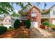 Charming two-story brick and siding home with a balcony and manicured landscaping at 1830 Broadway St, Decatur, GA 30035