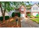 Charming townhome featuring a brick facade, garage, and front yard at 1830 Broadway St, Decatur, GA 30035