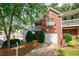 Traditional two-story home featuring brick accents, a balcony, and well-maintained landscaping at 1830 Broadway St, Decatur, GA 30035