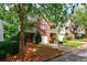 Exterior view of townhomes showcasing brick and siding with driveways at 1830 Broadway St, Decatur, GA 30035