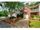Townhome with brick accents, a front yard, and a driveway at 1830 Broadway St, Decatur, GA 30035