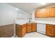 Corner view of kitchen featuring stainless appliances, oak cabinets, and serving bar at 1830 Broadway St, Decatur, GA 30035