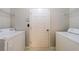 Laundry room with washer and dryer hookups, and shelving at 1830 Broadway St, Decatur, GA 30035