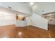 Living room with wood floors, staircase and view of kitchen at 1830 Broadway St, Decatur, GA 30035