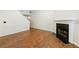 Living room with wood floors, fireplace and stairs at 1830 Broadway St, Decatur, GA 30035