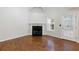 Living room featuring a fireplace, hardwood floors, and a door to the patio at 1830 Broadway St, Decatur, GA 30035