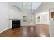 Bright living room with a fireplace, tall ceilings, and a doorway to the patio at 1830 Broadway St, Decatur, GA 30035