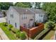 Aerial view of the home with a back deck and well-maintained landscaping at 2421 Elkhorn Ter, Duluth, GA 30096