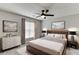 Bedroom with a ceiling fan, dresser, nightstands, and a large bed at 2421 Elkhorn Ter, Duluth, GA 30096