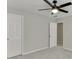 Bedroom with ceiling fan and neutral gray paint at 2421 Elkhorn Ter, Duluth, GA 30096