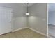 The breakfast nook has tiled floors and a light fixture at 2421 Elkhorn Ter, Duluth, GA 30096