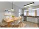 A light-filled dining room with a view into the kitchen for easy entertaining at 2421 Elkhorn Ter, Duluth, GA 30096