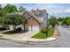 Exterior of the home with a front lawn and a two-car garage at 2421 Elkhorn Ter, Duluth, GA 30096