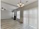 An open-concept living room features a fireplace, modern flooring, and a sliding glass door for natural light at 2421 Elkhorn Ter, Duluth, GA 30096