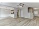 Open-concept living area with view of dining area, staircase, and modern flooring throughout at 2421 Elkhorn Ter, Duluth, GA 30096