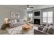 Inviting living room with cozy fireplace, neutral color palette, and an open layout at 2421 Elkhorn Ter, Duluth, GA 30096