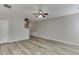 Spacious open-concept living area with modern flooring, neutral walls, and views of the stairway at 2421 Elkhorn Ter, Duluth, GA 30096