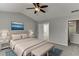 Bright main bedroom featuring a vaulted ceiling, ensuite bathroom, and stylish decor at 2421 Elkhorn Ter, Duluth, GA 30096
